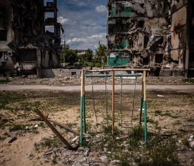 TOPSHOT - This photograph shows a playground and a destroyed apartment building in the town of Borodyanka on June 1, 2022, amid the Russian invasion of Ukraine. (Photo by Dimitar DILKOFF / AFP)